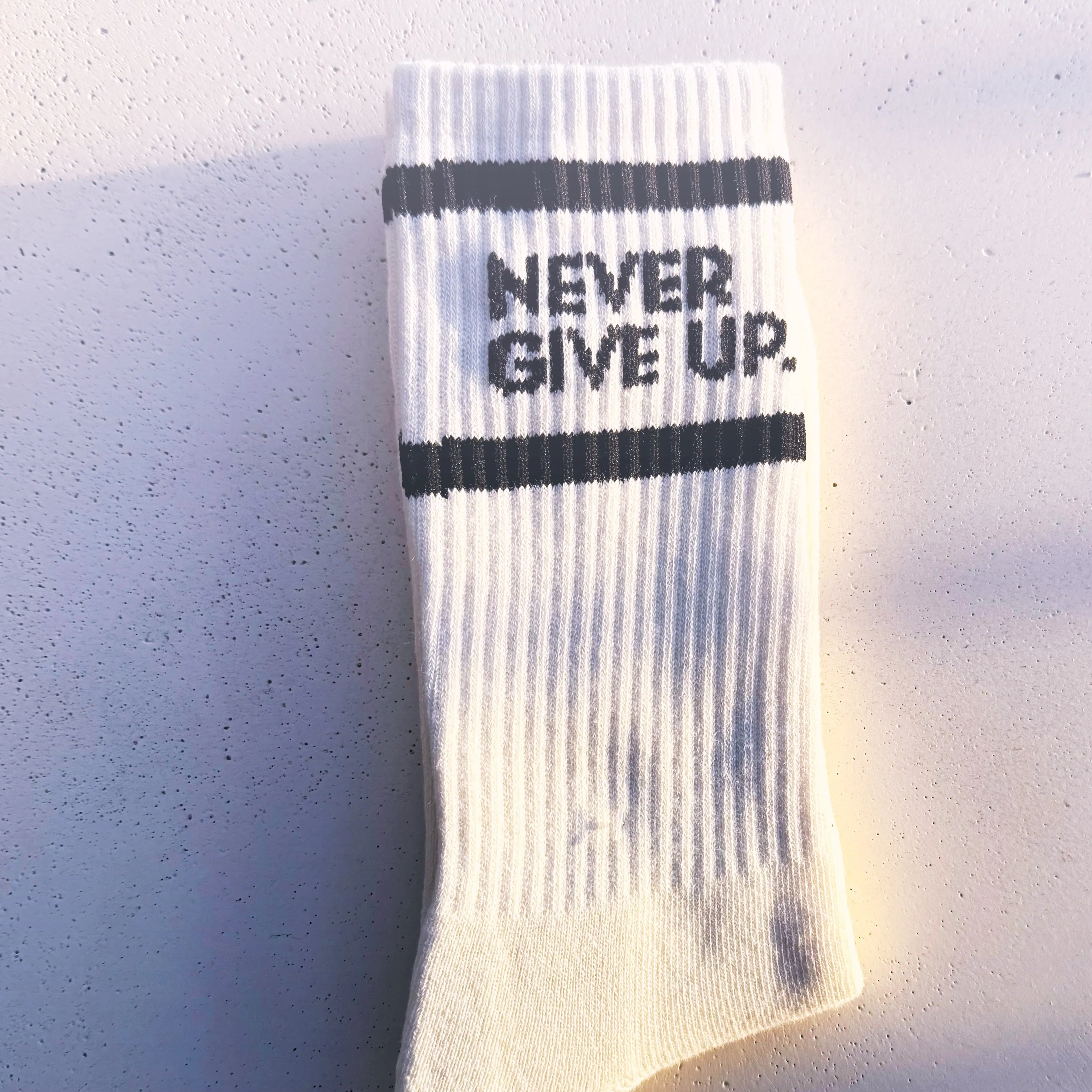 NEVER GIVE UP. STRIPED CREW SOCKS